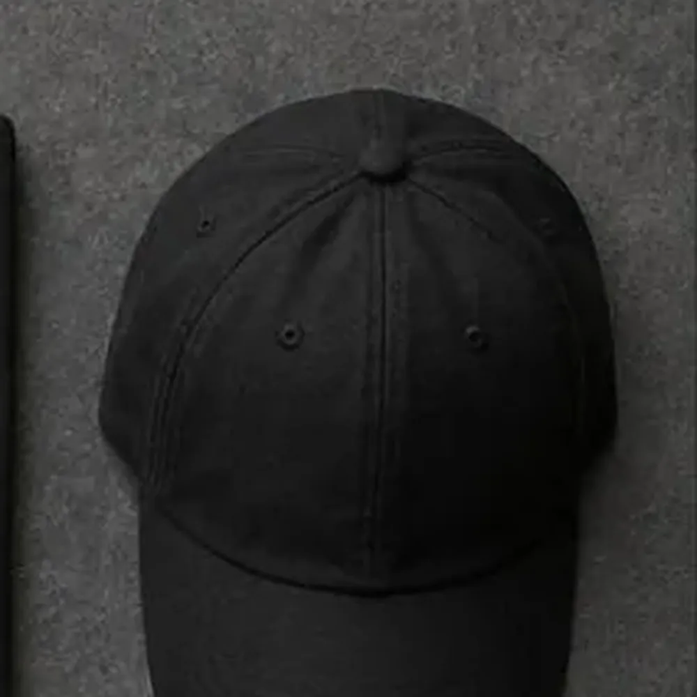 Black 6-panel cap with a front badge